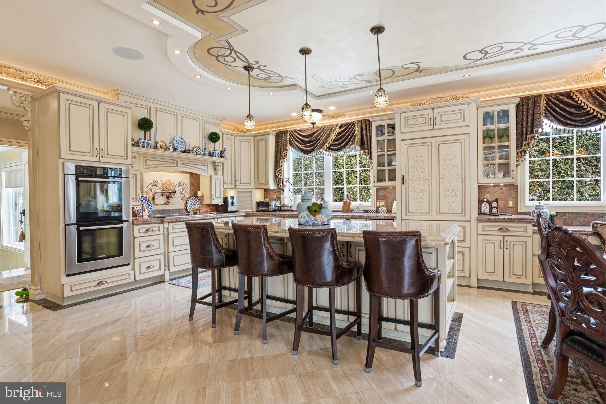 1066 Washington Crossing Road Washington Crossing, PA 18977 - Photo 12 of 92 a kitchen with granite countertop a table chairs stove and refrigerator