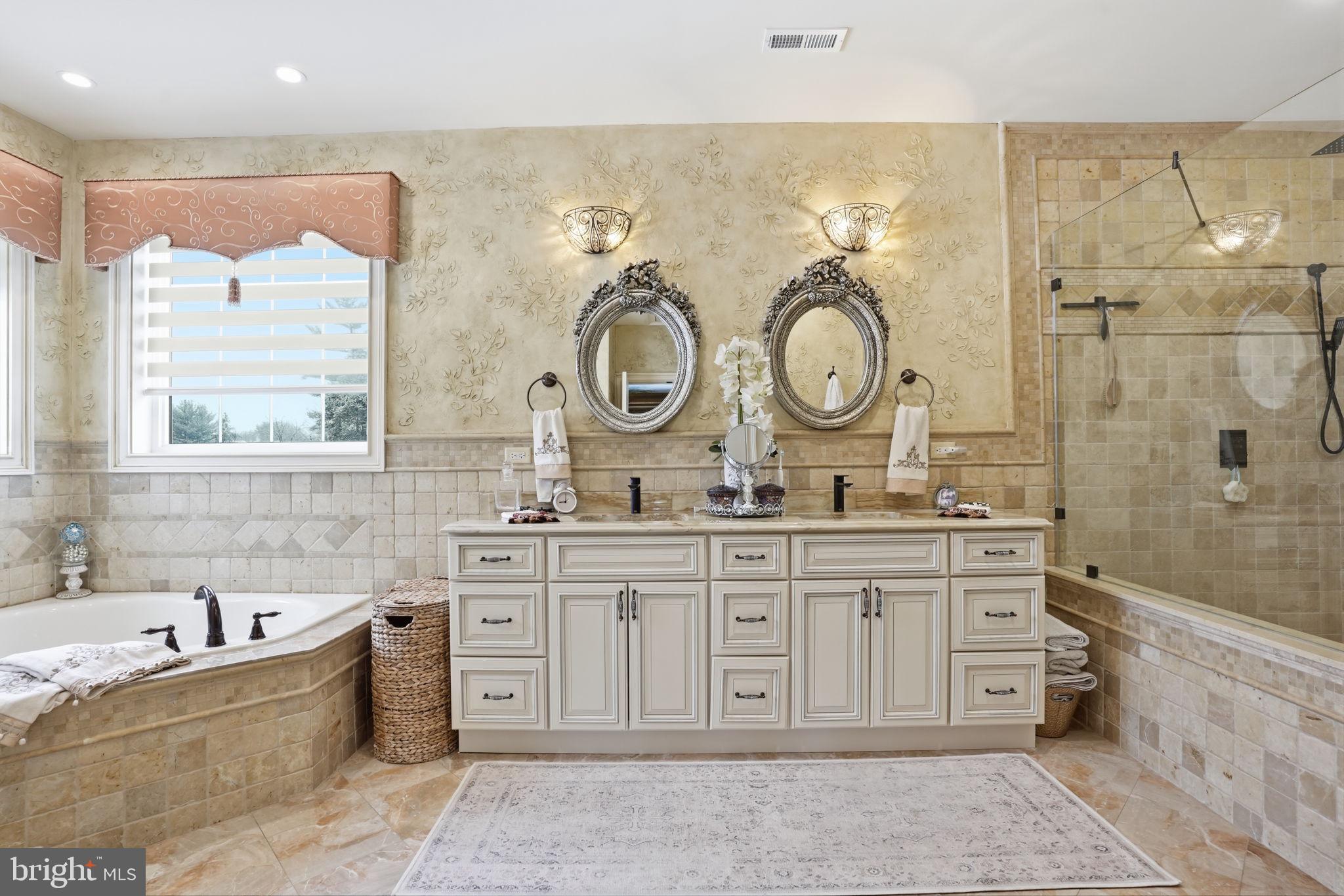 1066 Washington Crossing Road Washington Crossing, PA 18977 - Photo 26 of 92 a spacious bathroom with a granite countertop sink mirror and bathtub
