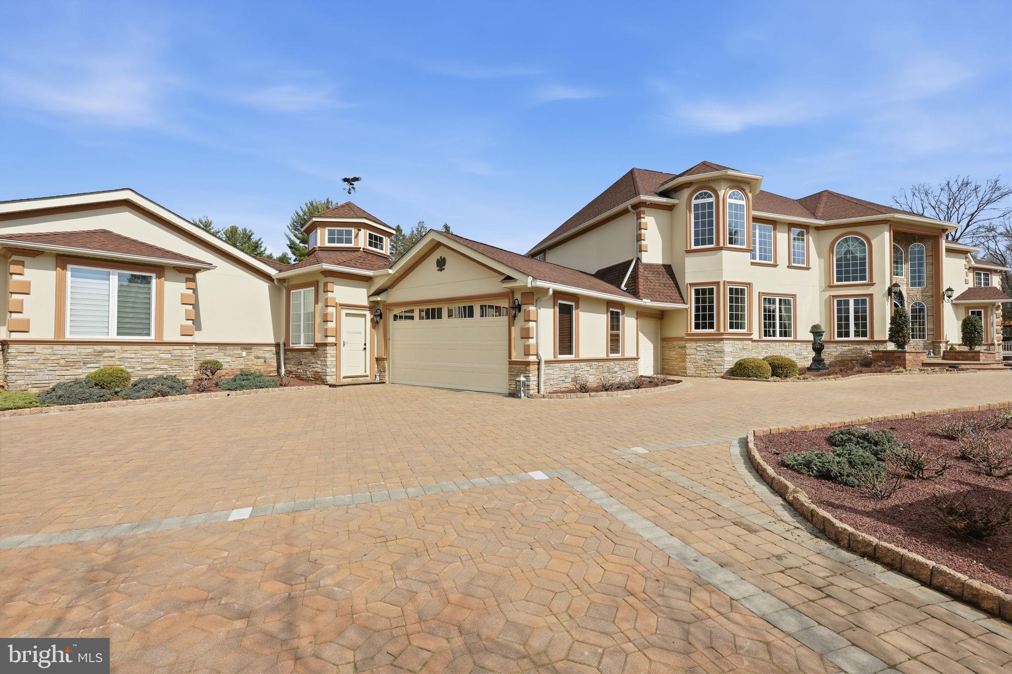1066 Washington Crossing Road Washington Crossing, PA 18977 - Photo 4 of 92 a view of a big house with a large windows and a road