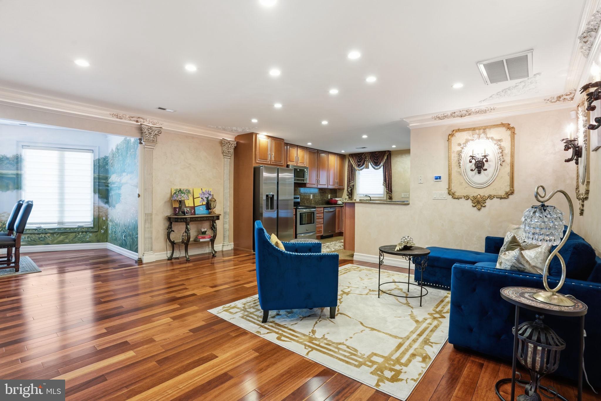 1066 Washington Crossing Road Washington Crossing, PA 18977 - Photo 49 of 92 a living room with couches and kitchen view with wooden floor