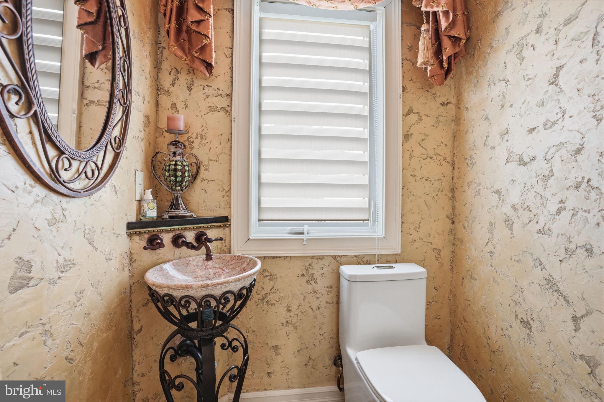 1066 Washington Crossing Road Washington Crossing, PA 18977 - Photo 50 of 92 a bathroom with a sink a toilet and a mirror