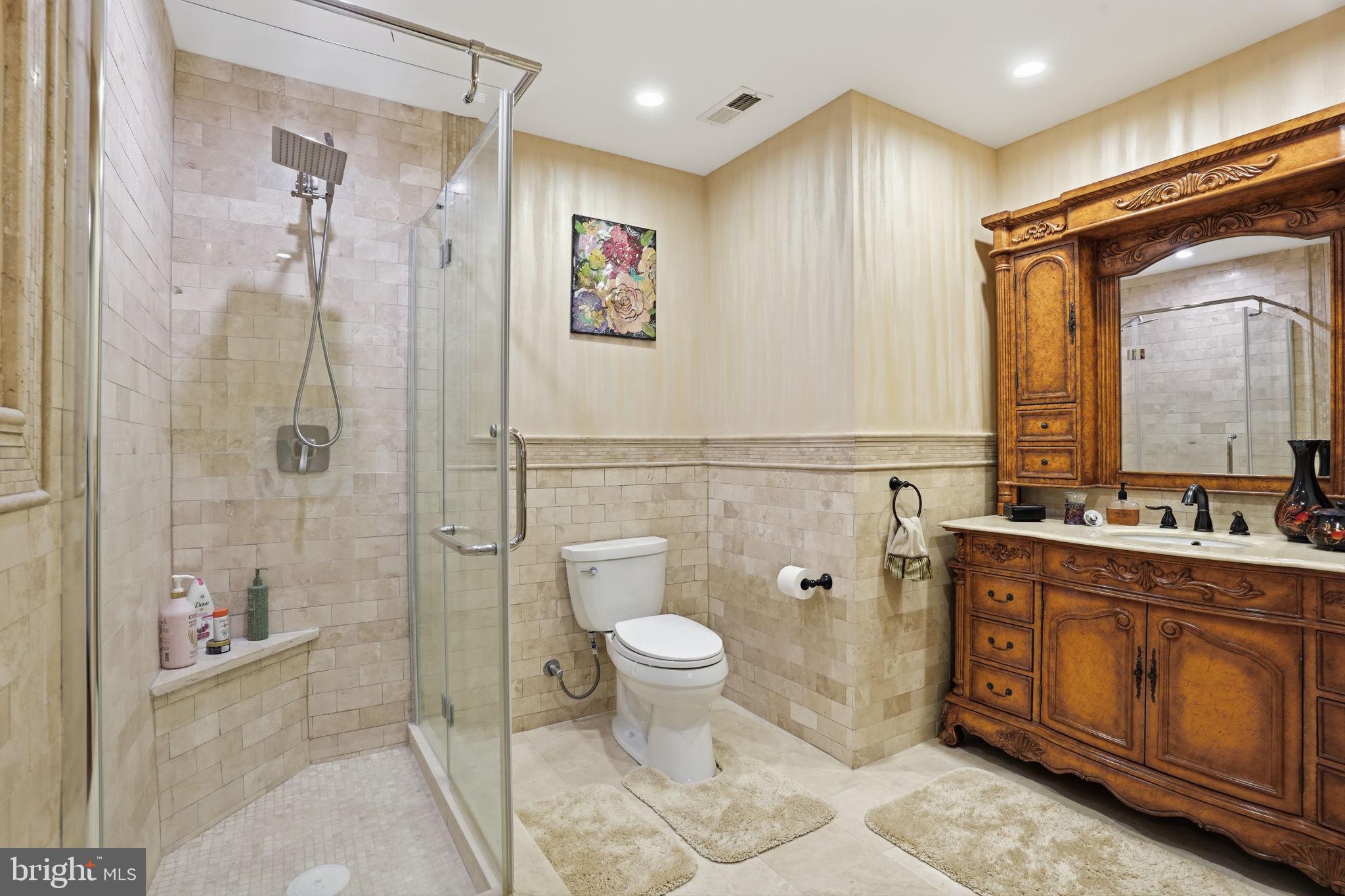 1066 Washington Crossing Road Washington Crossing, PA 18977 - Photo 51 of 92 a spacious bathroom with a double vanity sink toilet and shower