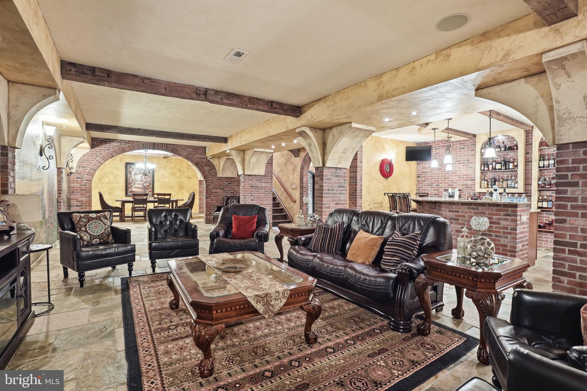 1066 Washington Crossing Road Washington Crossing, PA 18977 - Photo 64 of 92 a living room with furniture a rug and white walls