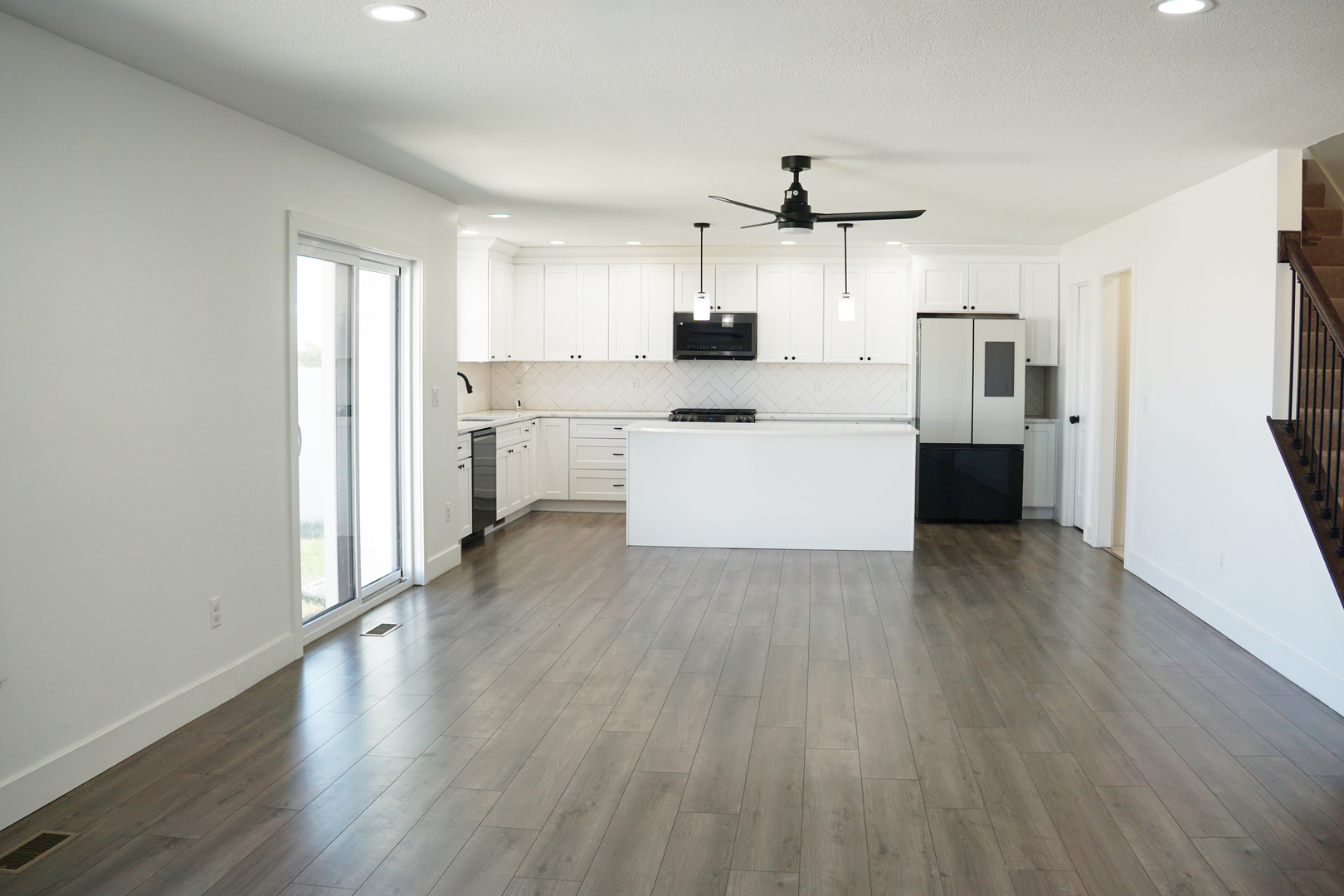752 Kristin Drive Normal, IL 61761 - Photo 13 of 36 a kitchen with a refrigerator and white cabinets