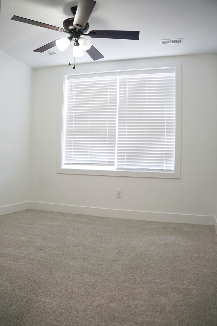 752 Kristin Drive Normal, IL 61761 - Photo 25 of 36 a view of an empty room with a window