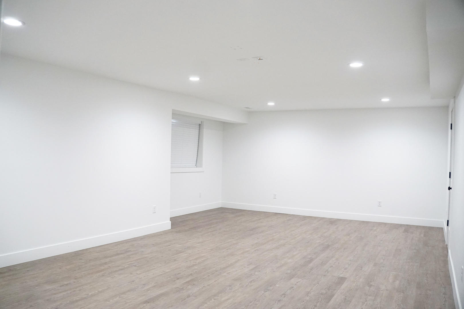 752 Kristin Drive Normal, IL 61761 - Photo 28 of 36 an empty room with wooden floor and windows