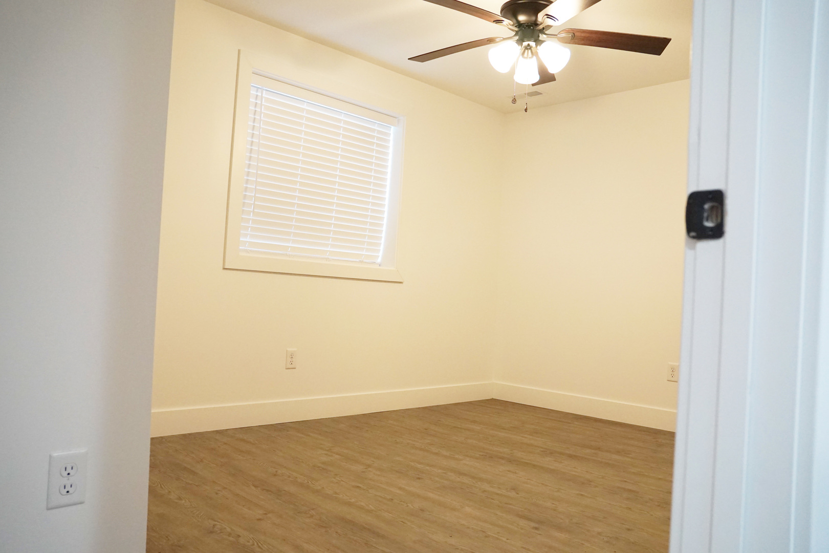 752 Kristin Drive Normal, IL 61761 - Photo 31 of 36 an empty room with a window and a fan