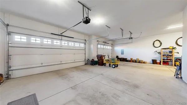 a view of a garage with rack and bicycle
