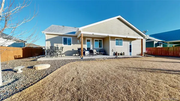 a front view of house with yard outdoor seating and barbeque oven