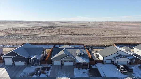 an aerial view of a house with a ocean view