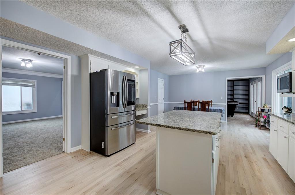16 High Point Drive Southwest Cartersville, GA 30120 - Photo 19 of 44 a kitchen with stainless steel appliances granite countertop a refrigerator and a sink