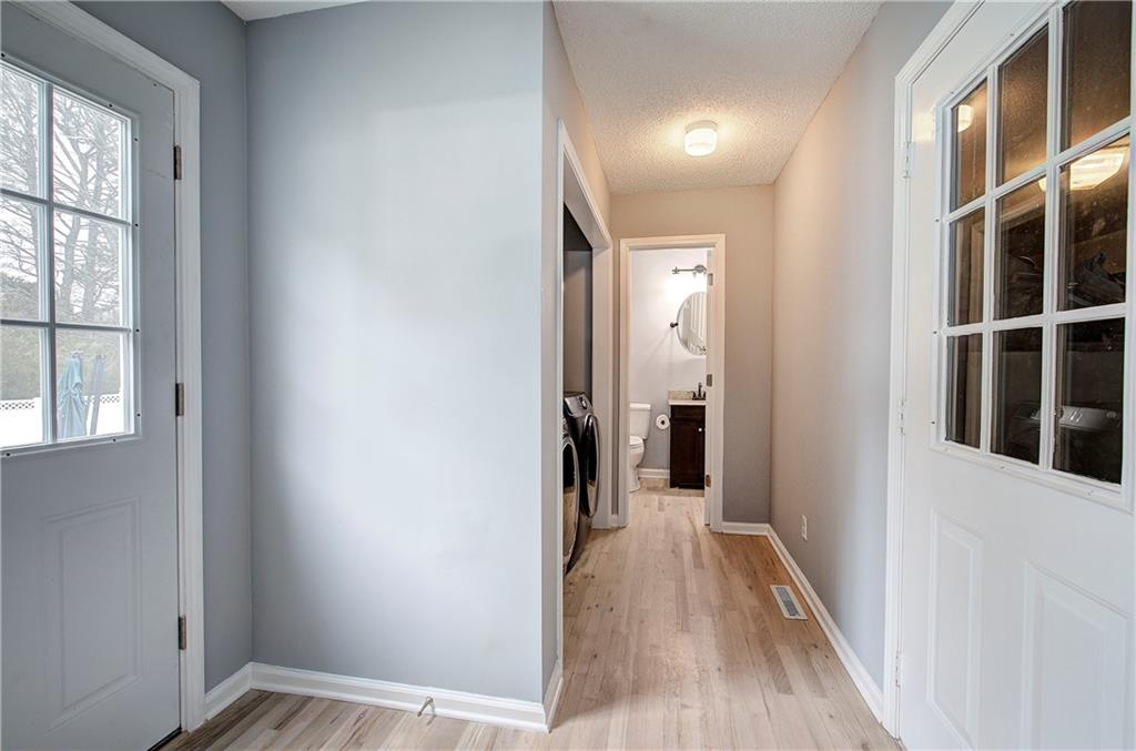 16 High Point Drive Southwest Cartersville, GA 30120 - Photo 20 of 44 a view of a hallway with wooden floor and windows