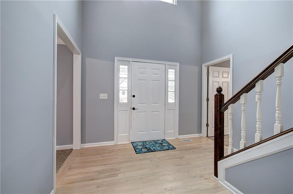16 High Point Drive Southwest Cartersville, GA 30120 - Photo 2 of 44 a view of a hallway with wooden floor and staircase