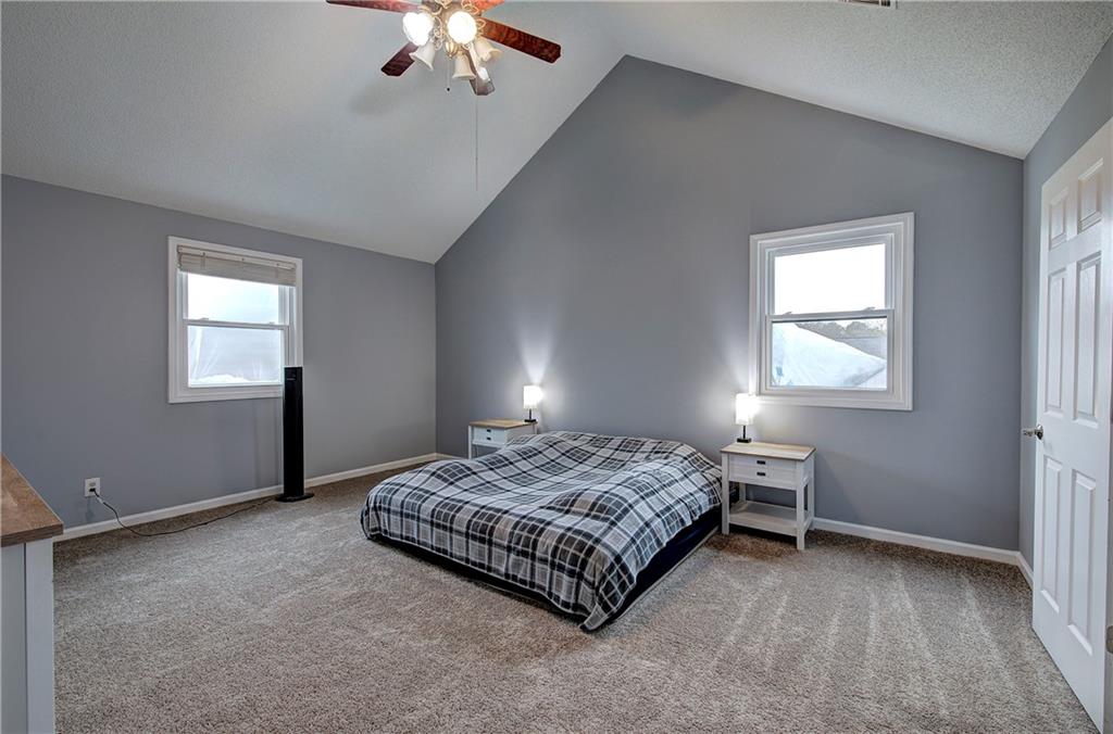16 High Point Drive Southwest Cartersville, GA 30120 - Photo 25 of 44 a spacious bedroom with a bed and window