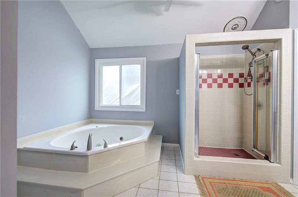 16 High Point Drive Southwest Cartersville, GA 30120 - Photo 27 of 44 a white bath tub sitting next to a bathroom