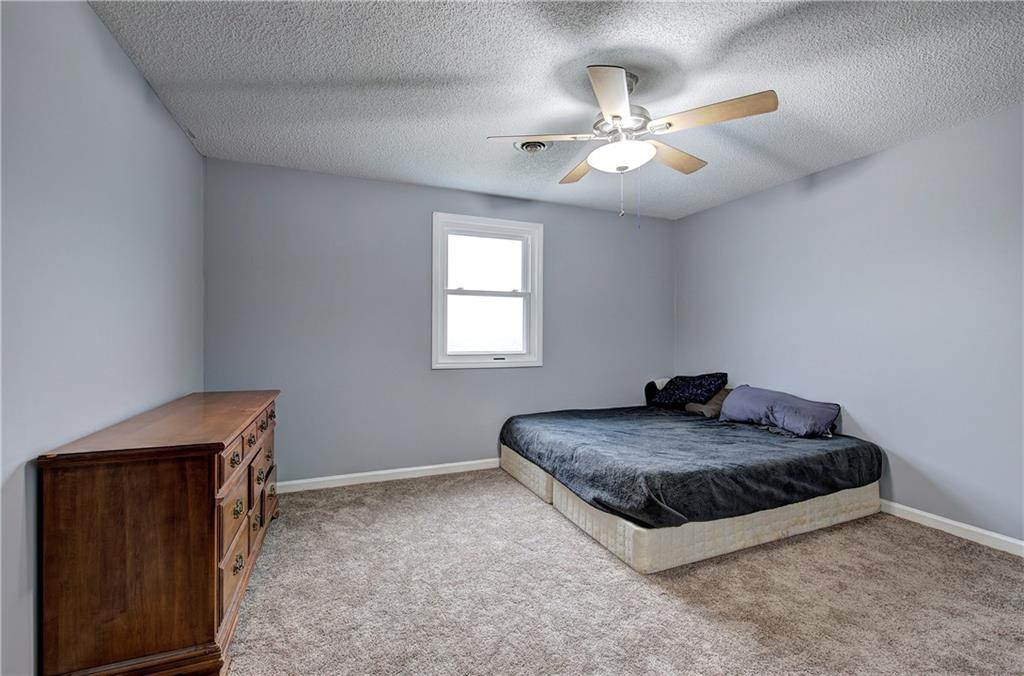 16 High Point Drive Southwest Cartersville, GA 30120 - Photo 37 of 44 a spacious bedroom with a bed and a dresser