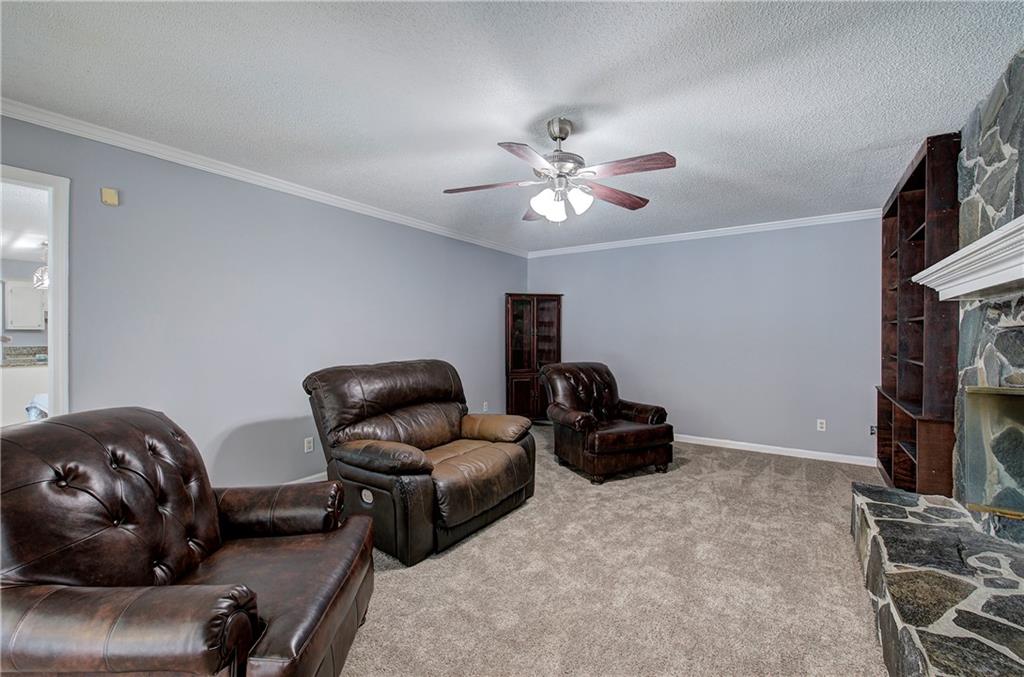 16 High Point Drive Southwest Cartersville, GA 30120 - Photo 10 of 44 a living room with furniture and a flat screen tv