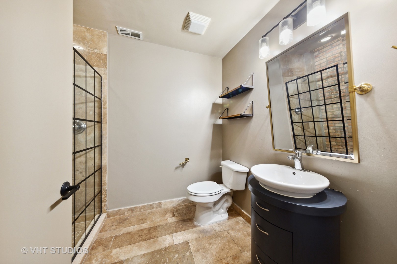 2545 South Dearborn Street, Unit 331 Chicago, IL 60616 - Photo 12 of 17 a bathroom with a sink toilet and shower
