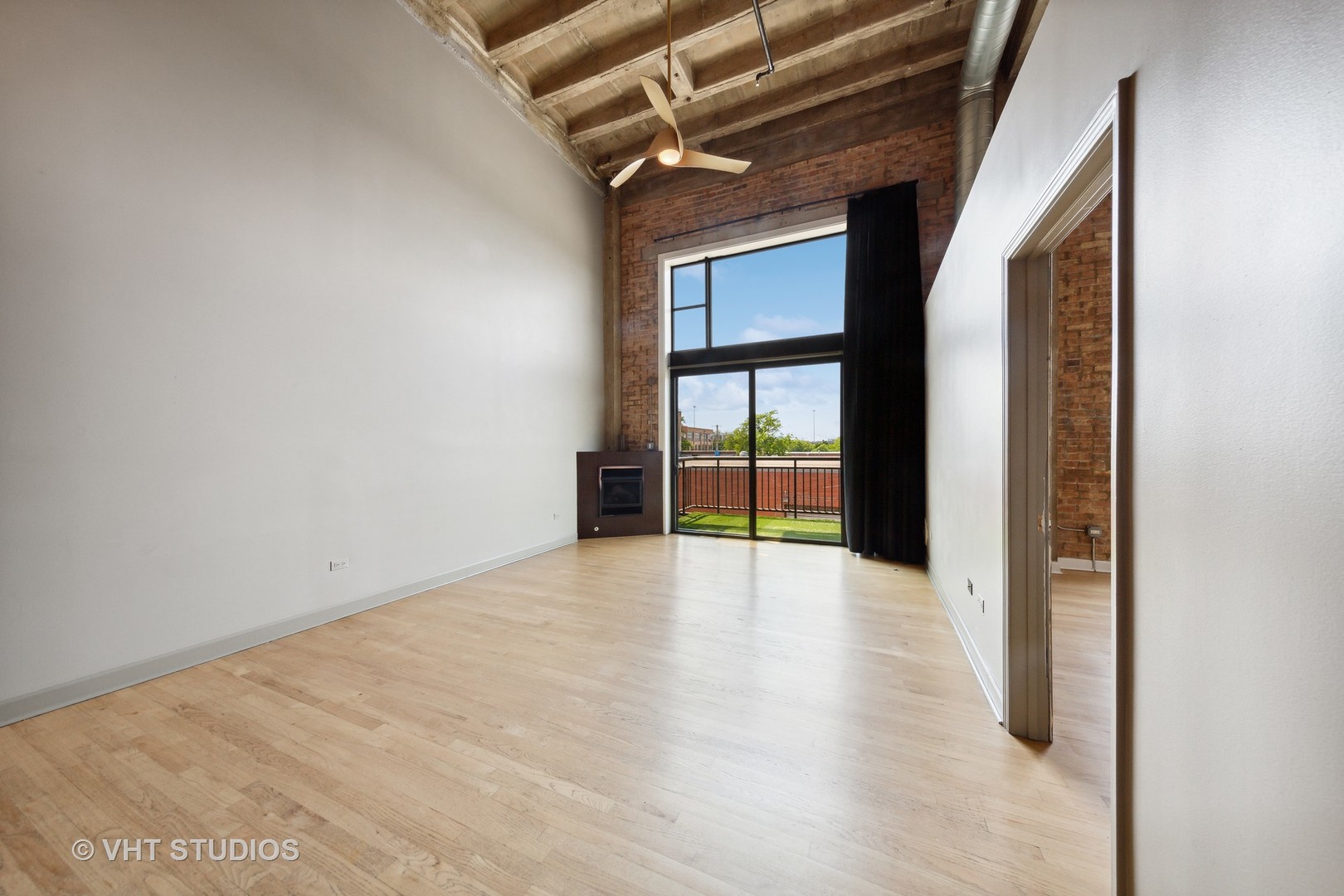 2545 South Dearborn Street, Unit 331 Chicago, IL 60616 - Photo 3 of 17 a view of an empty room with a window