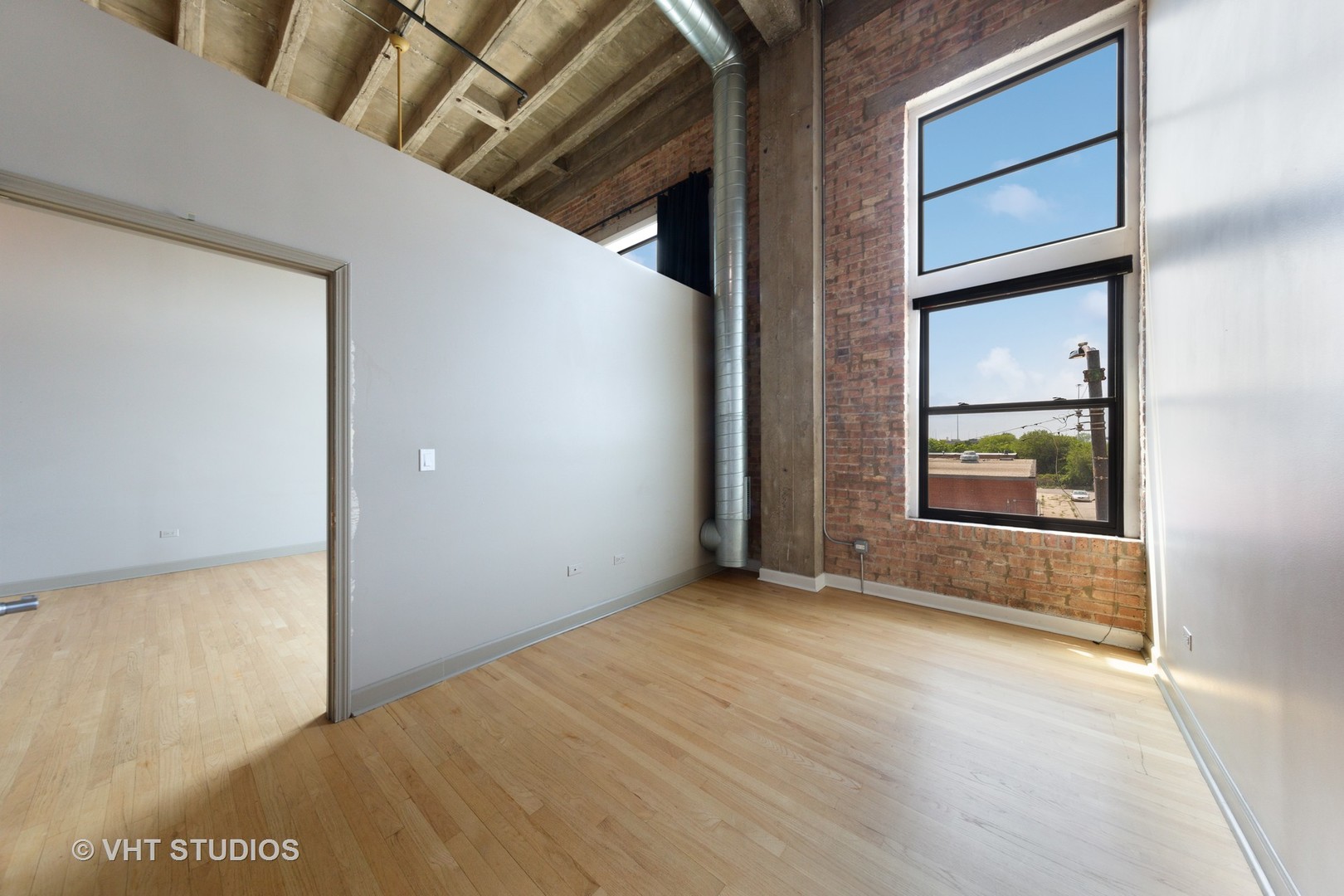 2545 South Dearborn Street, Unit 331 Chicago, IL 60616 - Photo 7 of 17 a view of an empty room with window