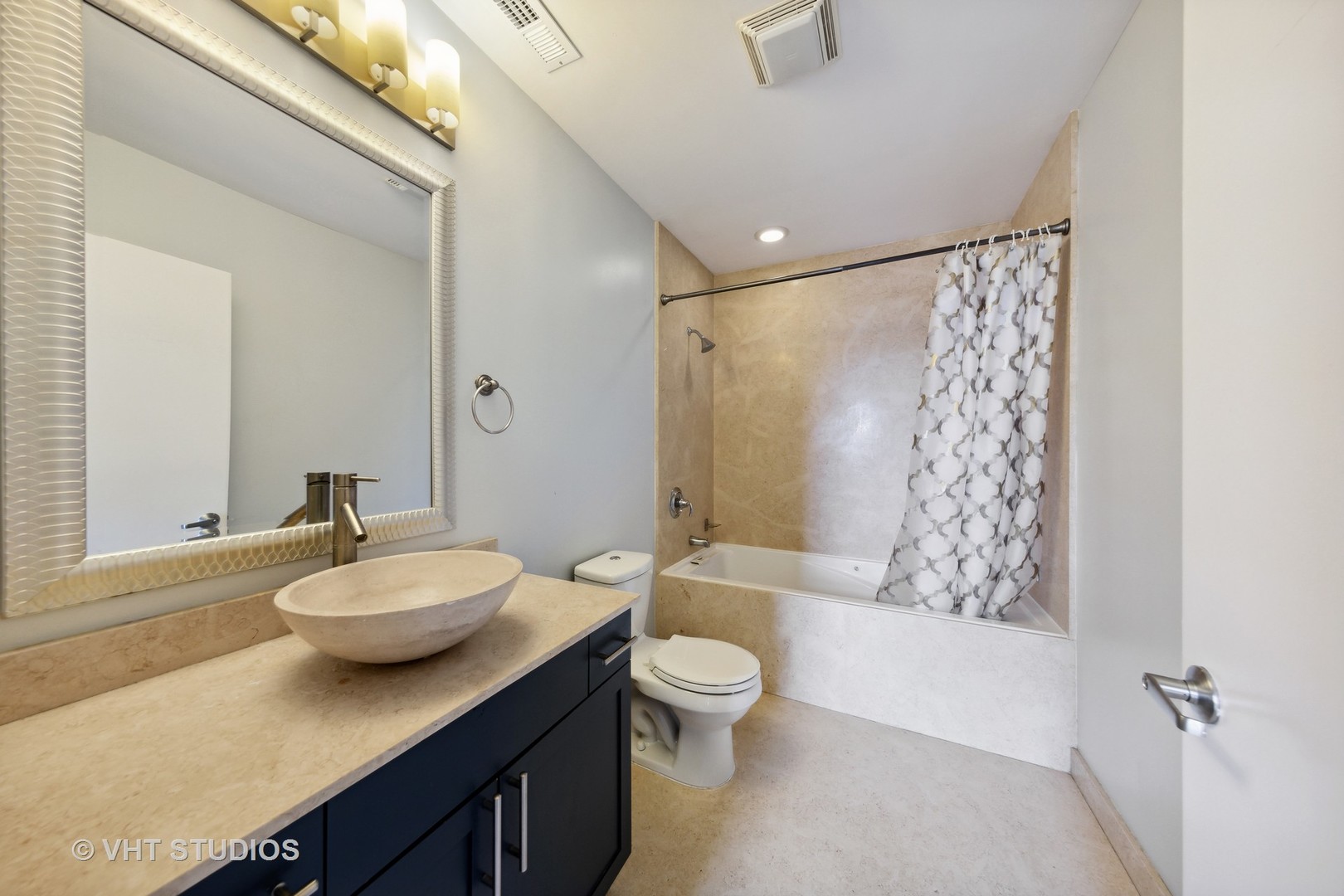2545 South Dearborn Street, Unit 331 Chicago, IL 60616 - Photo 9 of 17 a bathroom with a double vanity sink toilet and shower