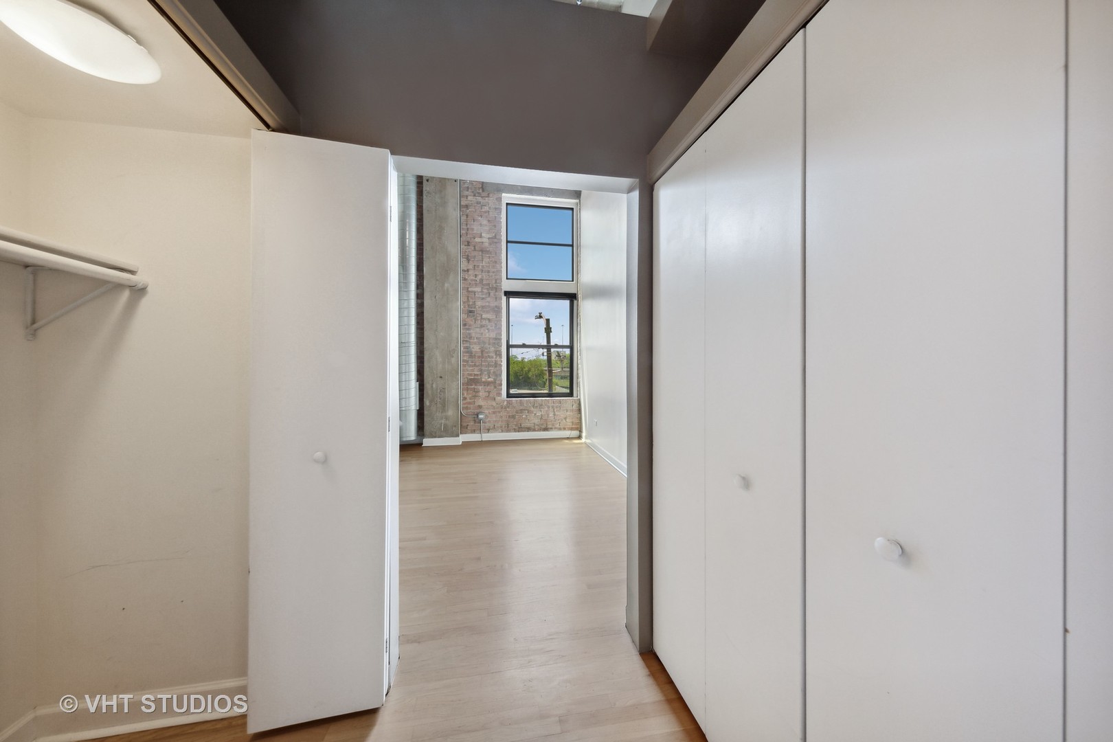 2545 South Dearborn Street, Unit 331 Chicago, IL 60616 - Photo 10 of 17 a view of a hallway with wooden floor