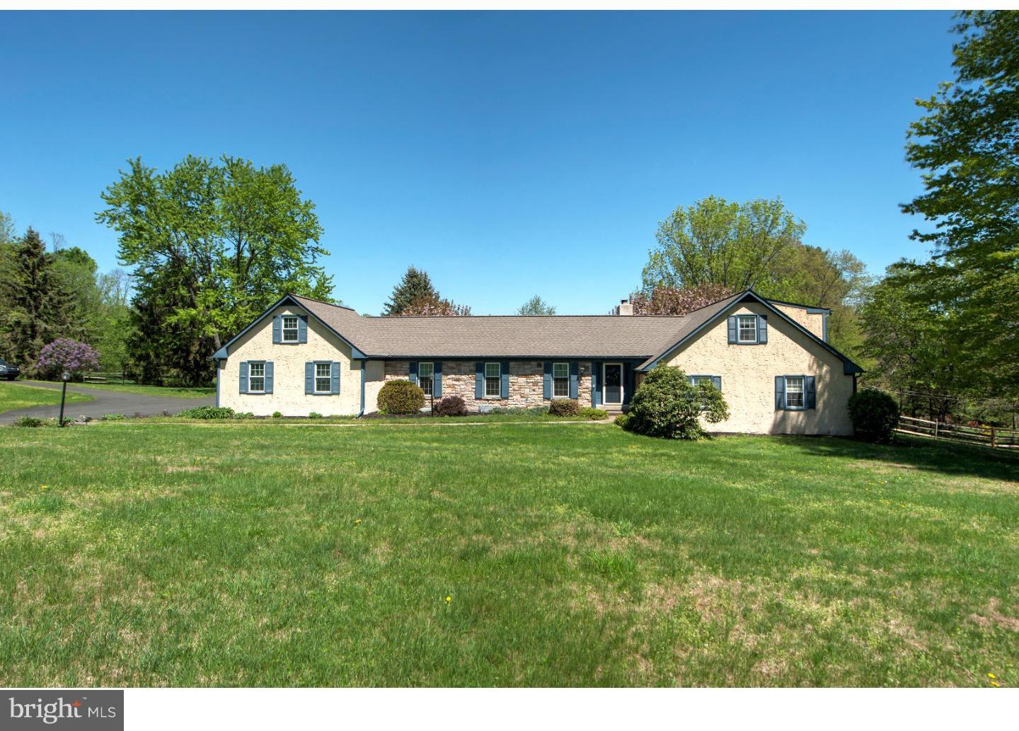 2841 Furlong Road Doylestown, PA 18902 - Photo 1 of 20 a front view of a house with a garden