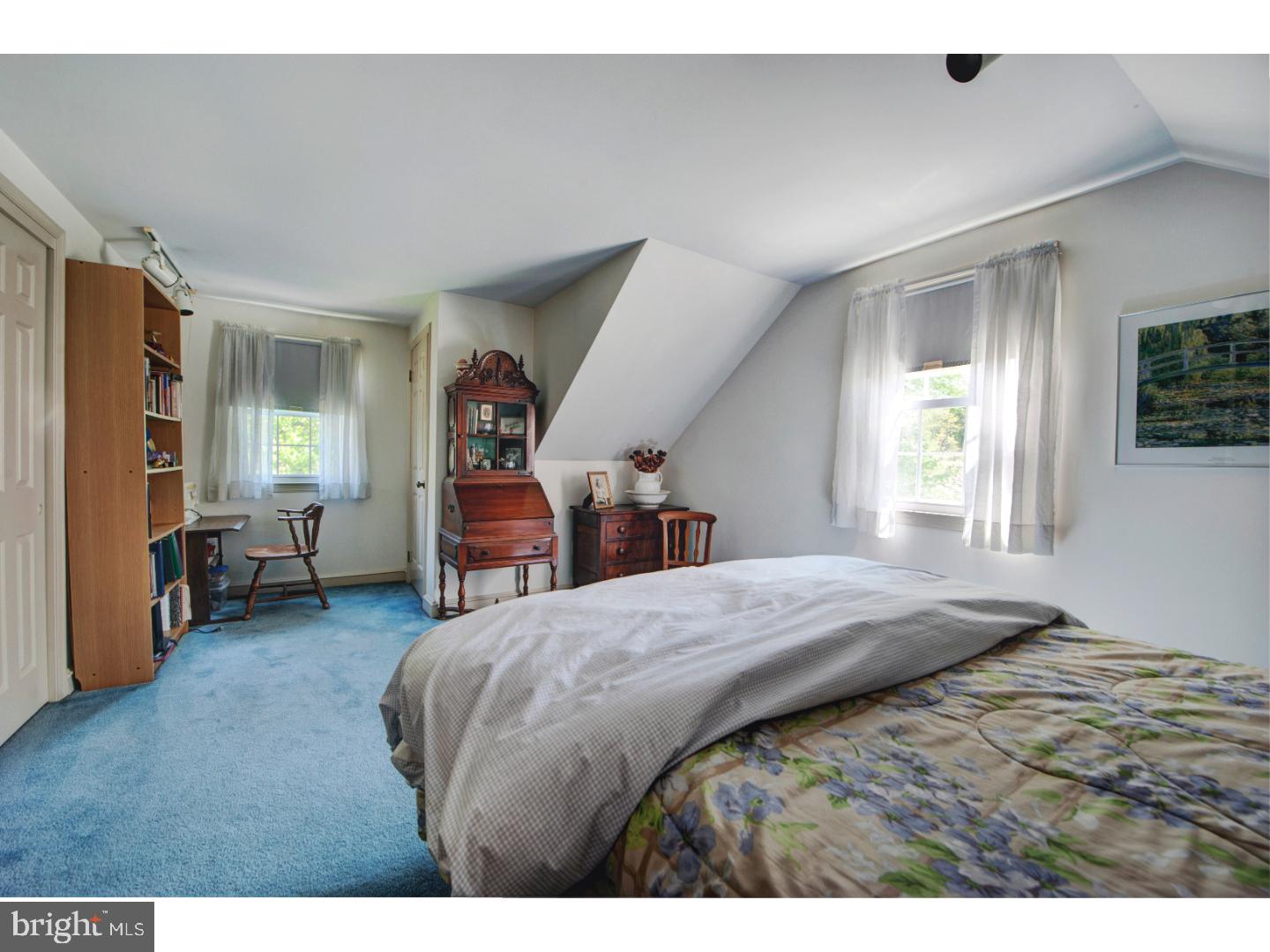 2841 Furlong Road Doylestown, PA 18902 - Photo 15 of 20 a bed room with a bed and a chair