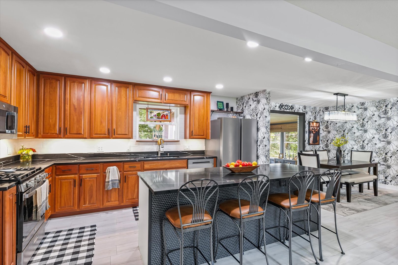 5 Golfview Drive Savoy, IL 61874 - Photo 13 of 42 a dining hall with stainless steel appliances granite countertop a stove a sink a dining table and chairs