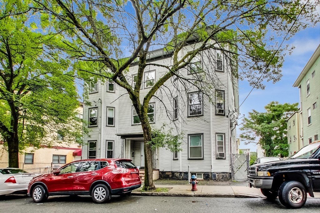 109 Walnut Street Somerville, MA 02145 - Photo 1 of 42 a car parked in front of a house