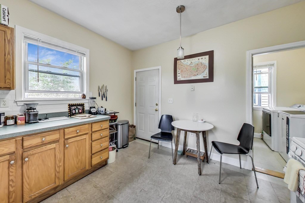 109 Walnut Street Somerville, MA 02145 - Photo 17 of 42 a view of a kitchen area with furniture and window