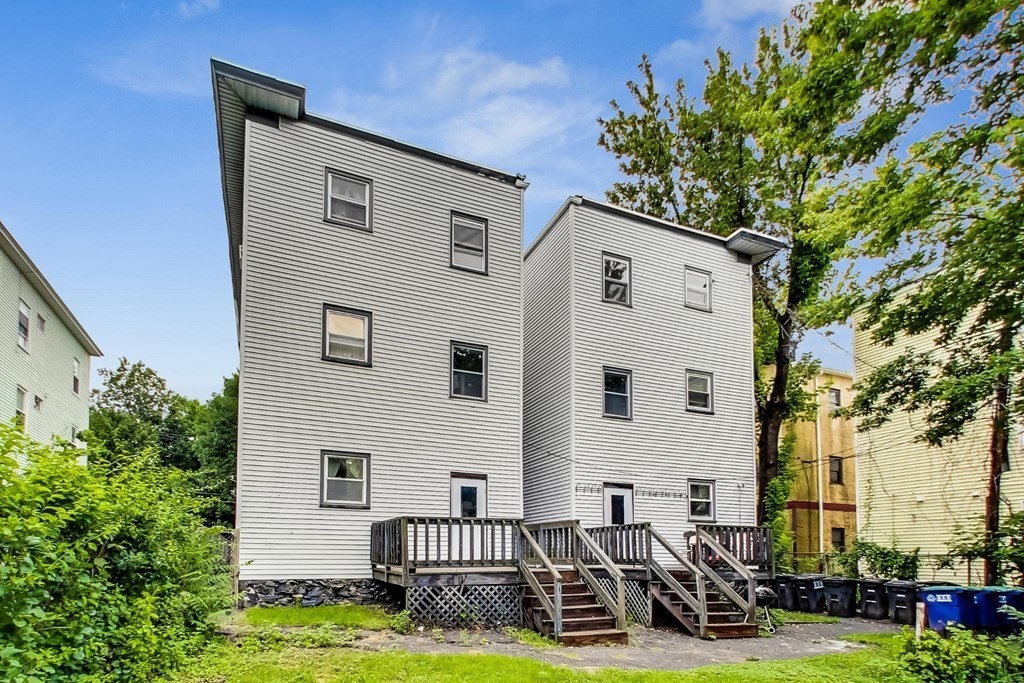 109 Walnut Street Somerville, MA 02145 - Photo 2 of 42 a front view of a house with garden