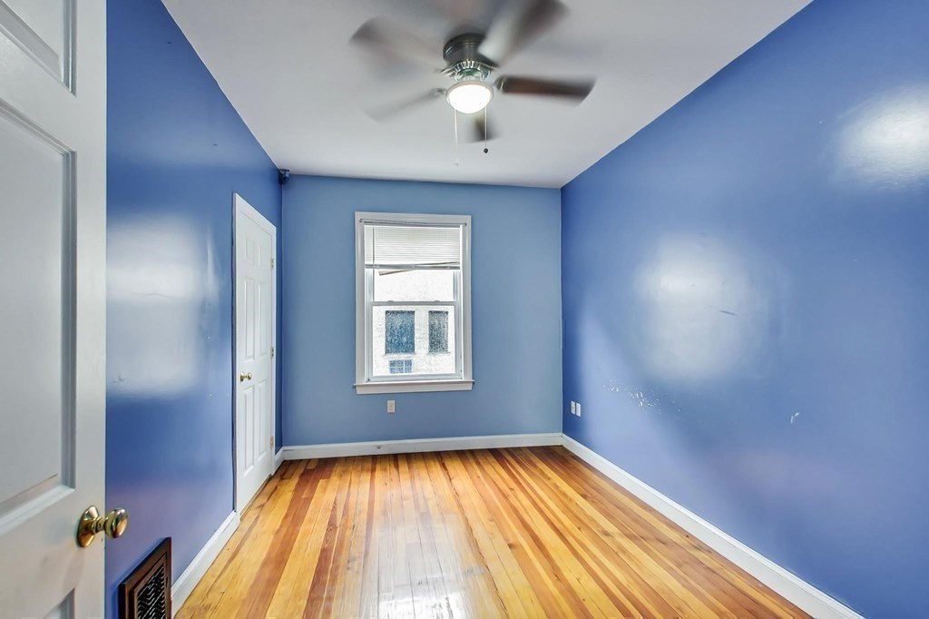 109 Walnut Street Somerville, MA 02145 - Photo 27 of 42 wooden floor in an empty room with a window