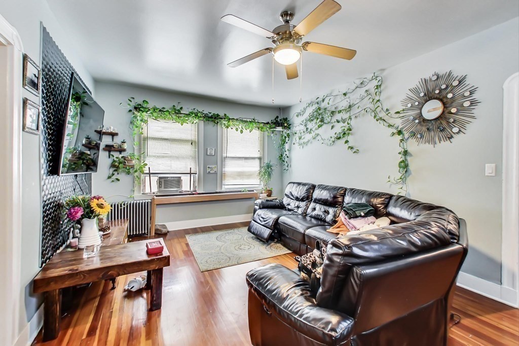 109 Walnut Street Somerville, MA 02145 - Photo 5 of 42 a living room with furniture and a large window