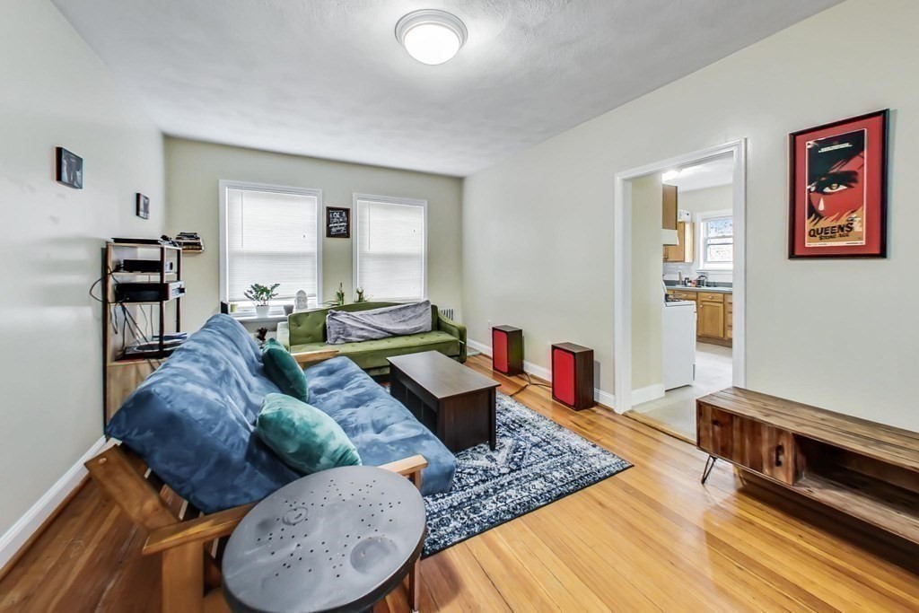 109 Walnut Street Somerville, MA 02145 - Photo 7 of 42 a living room with furniture and wooden floor