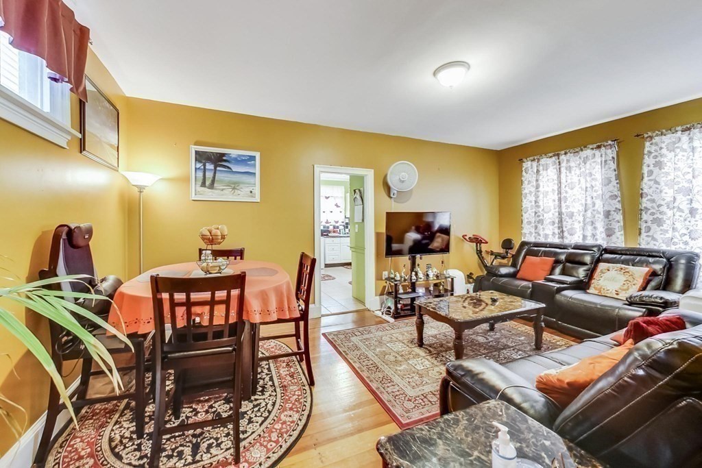 109 Walnut Street Somerville, MA 02145 - Photo 10 of 42 a living room with furniture and a flat screen tv