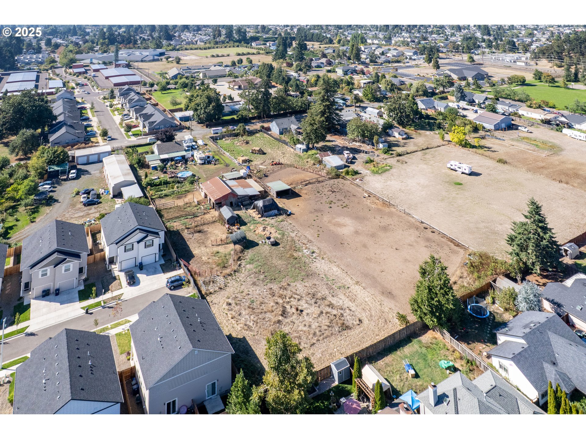 945 South 43rd Street Springfield, OR 97478 - Photo 7 of 15 an aerial view of residential houses with outdoor space