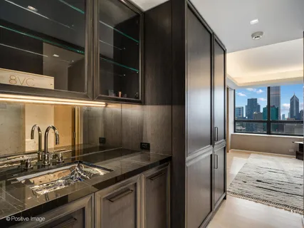 a bathroom with a sink mirror and toilet