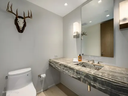 a living room with furniture a table and a bookshelf