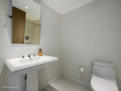 a bathroom with a double vanity sink mirror and double