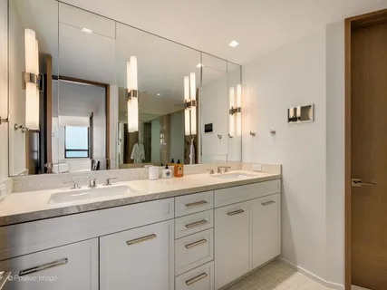 a bedroom with a bed and a television