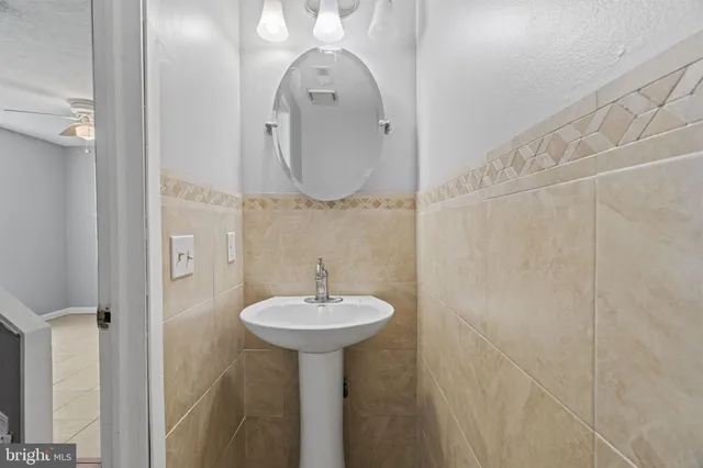 a bathroom with a sink a mirror and shower