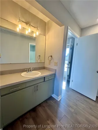a bathroom with a sink and mirror
