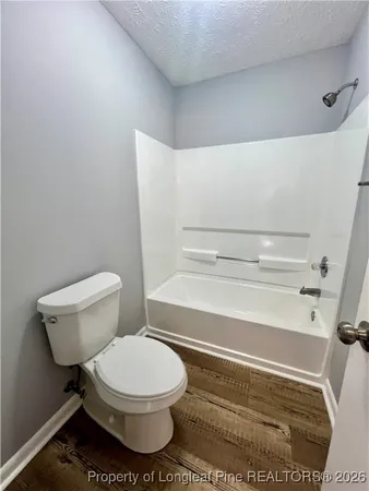 a bathroom with a toilet and a sink