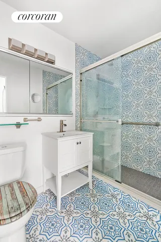 a kitchen with stainless steel appliances a refrigerator and a stove top oven