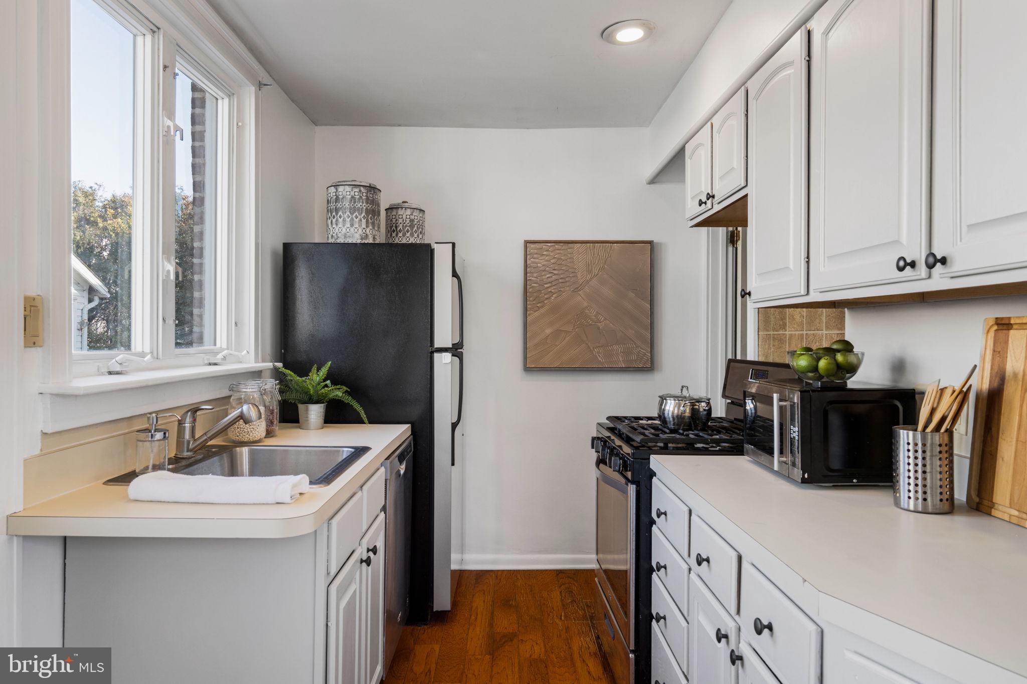 264 Pancoast Avenue Springfield, PA 19064 - Photo 18 of 38 a kitchen with a sink and a refrigerator