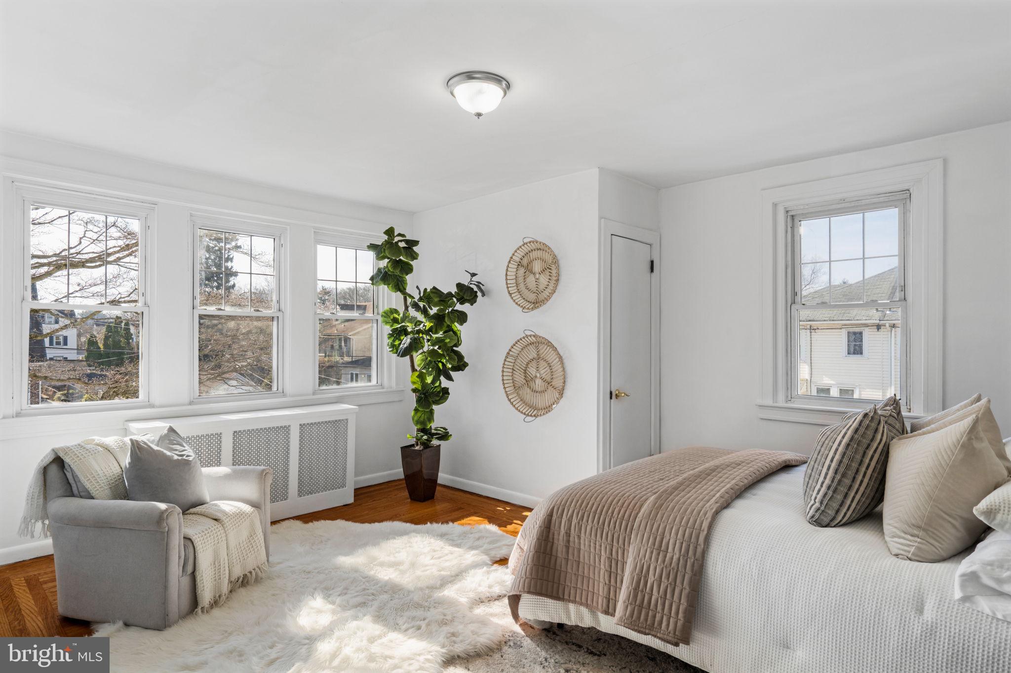 264 Pancoast Avenue Springfield, PA 19064 - Photo 21 of 38 a bedroom with a bed and dresser with windows