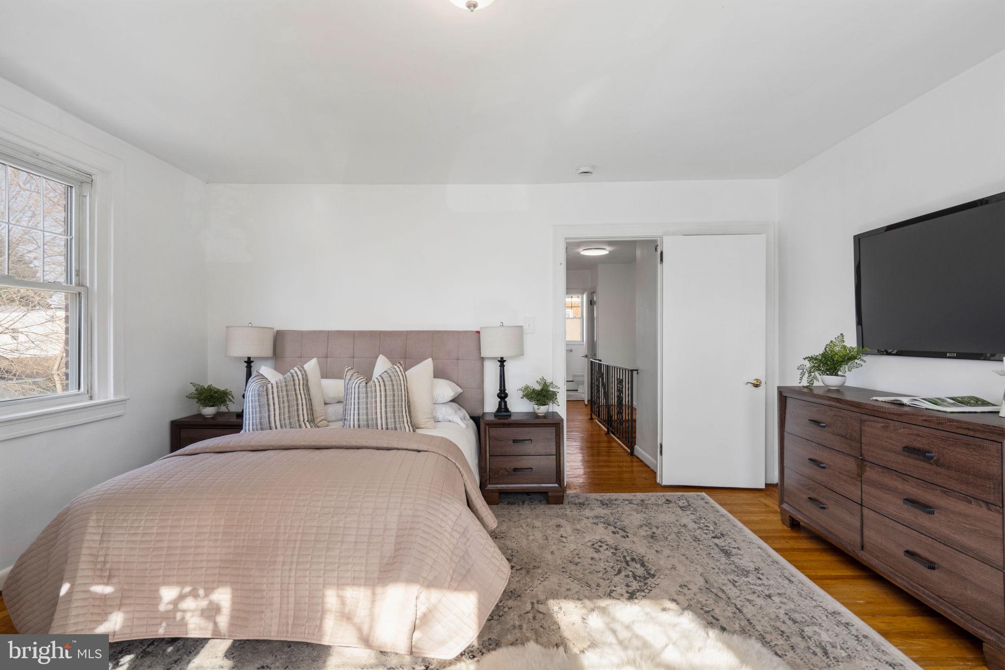 264 Pancoast Avenue Springfield, PA 19064 - Photo 23 of 38 a bedroom with a bed and a flat screen tv