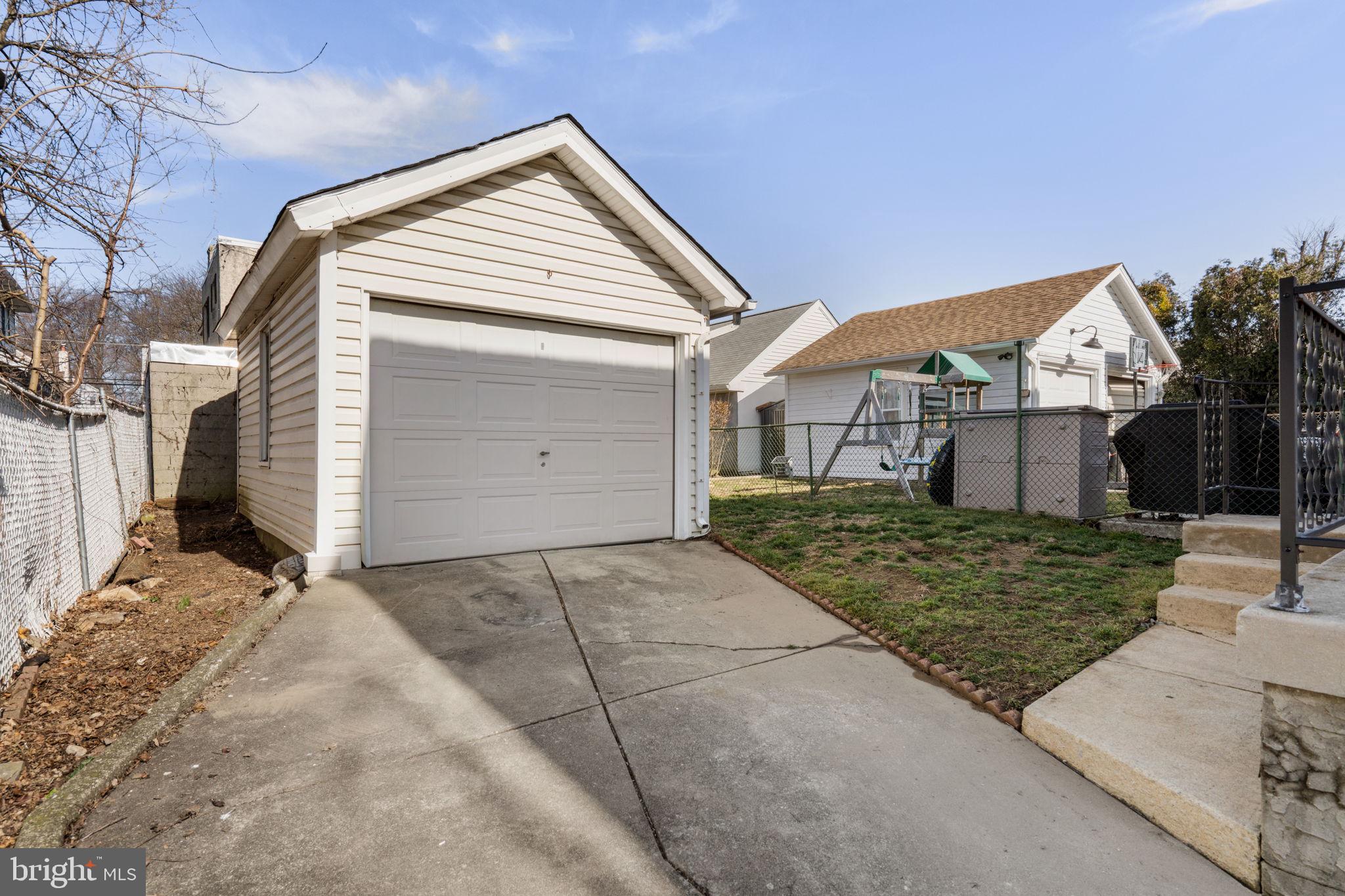 264 Pancoast Avenue Springfield, PA 19064 - Photo 35 of 38 a view of a house with a yard and garage