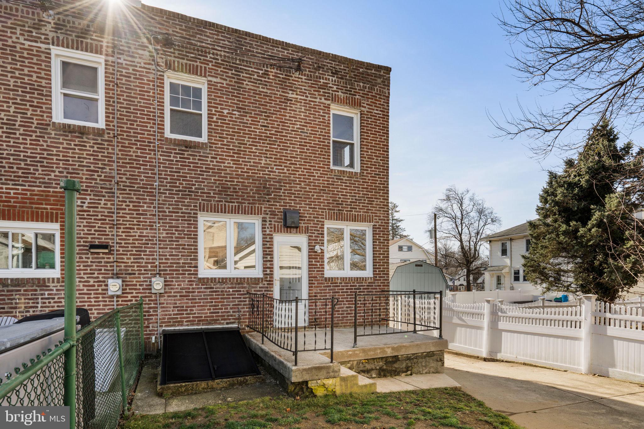 264 Pancoast Avenue Springfield, PA 19064 - Photo 37 of 38 a brick building that has a tree in front of it